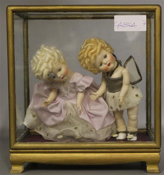 Cased pair of French porcelain dolls